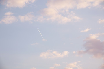 evening sky with clouds and flight