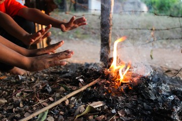  Children sit by the fire in the winter