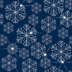 Seamless pattern. White snowflakes on a blue background. Christmas pattern.