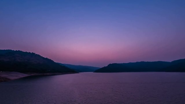 Sunrise in morning on reservoir, Thailand.