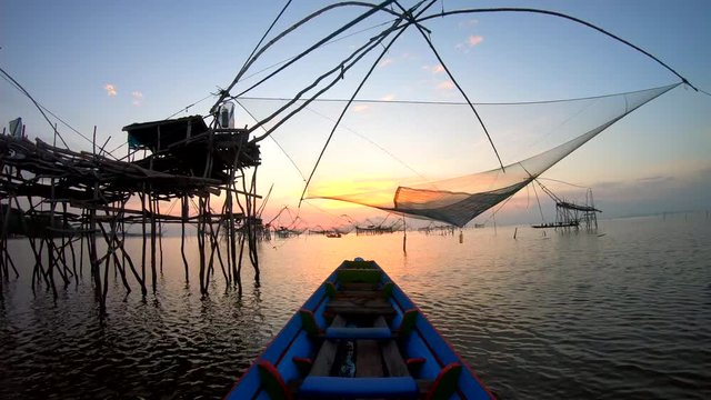 View  Sunrise at Sri Pak Pra Fishing Traditional Local Fishing Trap also Known as Yor Building at Pakpra Thale Noi Lake in Phatthalung province Thailand