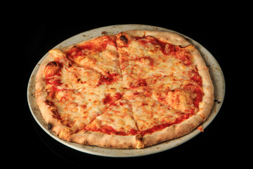 delicious whole sliced cheese pizza on round white plate
