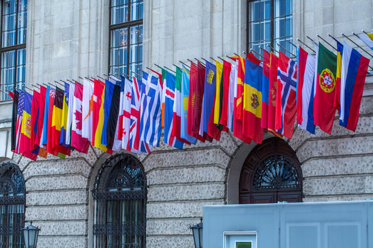 Flags of almost all countries of the northern hemisphere on the facade the building of Hofburg palace in Vienna, Austria.