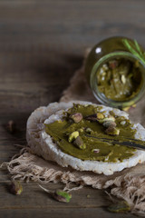 Pistachio nut butter creamed on a slice of rice crispbread.