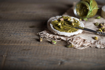 Pistachio nut butter creamed on a slice of rice crispbread.