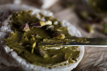 Pistachio nut butter creamed on a slice of rice crispbread.