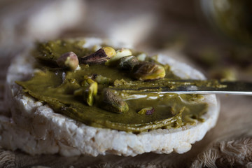 Pistachio nut butter creamed on a slice of rice crispbread.