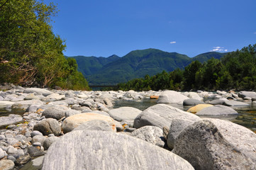 River with Stones and Mountain in Switzerland.