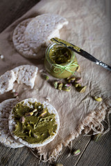 Pistachio nut butter creamed on a slice of rice crispbread.