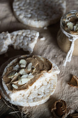 Homemade almond butter on a slice of rice crispbread.