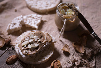 Homemade almond butter on a slice of rice crispbread.