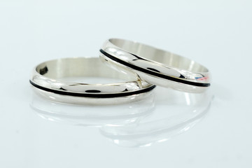 wedding rings, a symbol of love and happiness, on a white background