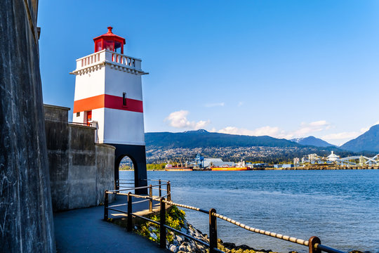 Brockton Point with the famous lighthouse on the famous Seawall pathway in Vancouver's Stanley Park in British Columbia, Canada