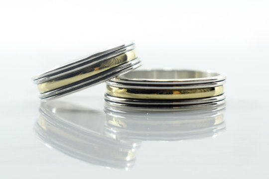 wedding rings, a symbol of love and happiness, on a white background