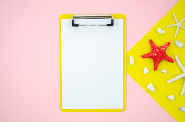 Top view summer beach frame with clipboard mockup and starfishes and shells. Flat lay with copy space