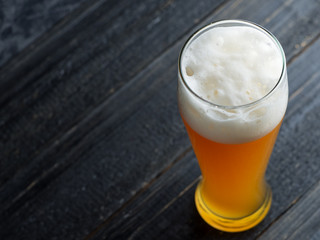 Wheat unfiltered beer in a glass close-up
