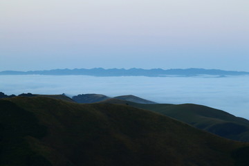 Fog over coastl hills