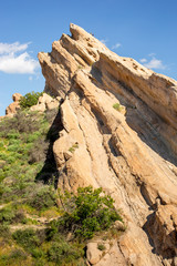 Fototapeta na wymiar Familiar slanting rock formations at Vasquez Rocks Natural Area Park in Agua Dulce