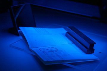 Checking the passport for fraud in UV and another light, detection of luminescence of protective...