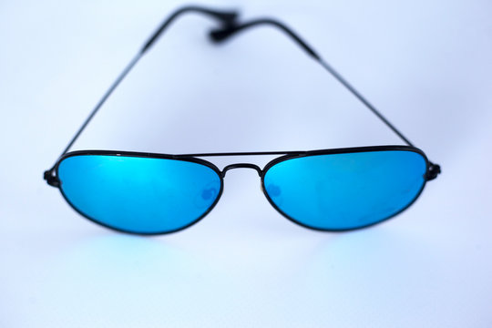 Blue mirrored sunglasses with anti-reflective coating and UV