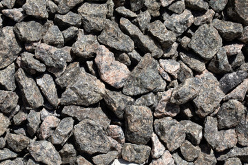 Stone background of pebbles, gravel. Texture of empty surface..Copy space for design.