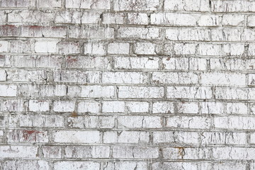 Old wall made of red brick, painted white in loft style for modern designer interior of room, bar or restaurant