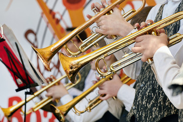 Naklejka na ściany i meble A closeup of several trumpeters playing