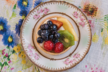 Fruit tart on colorful background