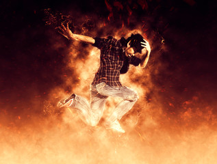 Man break dancing on fire background