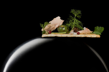 aperitif on lunar bowl and dark background