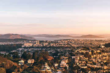 Fototapeta na wymiar Landscape of San Francisco surrounded by mountains during a sunset