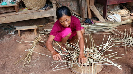 bamboo basket craftsman while doing his work in a place, Batang / Jawa Tengah - Indonesia, May 26, 2019