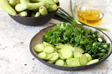 Fresh salad with armenian cucumber, green onions and herbs