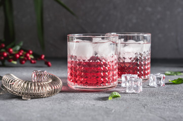 Red fruit lemonades on rustic background