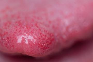 Macro closeup of man's tongue