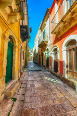 Naklejka na ściany i meble Walking around the old streets of baroque town Ragusa Ibla in Sicily