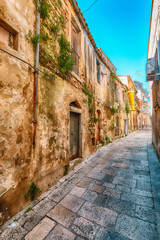 Fototapeta na wymiar Walking around the old streets of baroque town Ragusa Ibla in Sicily