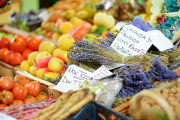 Assorted organic vegetables and greenery sold on a marketplace in Genoa, Italy