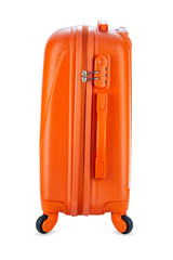 Travel orange suitcase isolated on white background. Close-up.