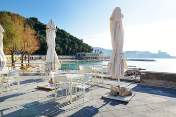 Outdoor restaurants and cafes on a seafront of Lerici town, a part of the Italian Riviera, Italy.