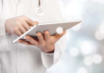Close-up Doctor at hospital working with tablet pc