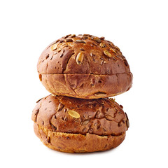 Two brown burger buns on white background