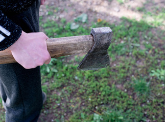 A man with an ax in his hands.