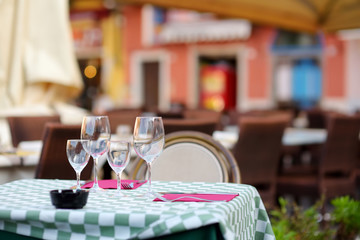 Beautifully decorated small outdoor restaurant tables in the city of Lerici, Italy