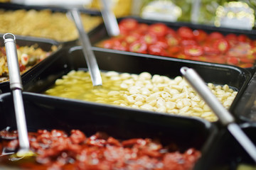 Assorted organic pickled garlic sold on a marketplace in Genoa, Italy