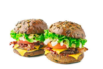 Two hamburgers with cereal buns on white background