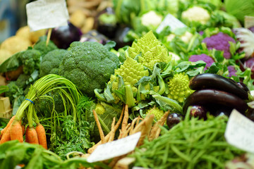 Assorted organic vegetables and greenery sold on a marketplace in Genoa, Italy