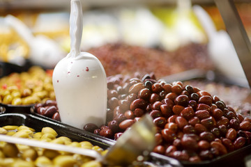 Assorted olives on farmer's market in town in Italy