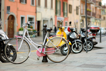 Fototapeta na wymiar Row of bicycles parked on beautiful medieval streets of Bergamo, Lombardy, Italy.