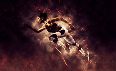 woman running on fire background